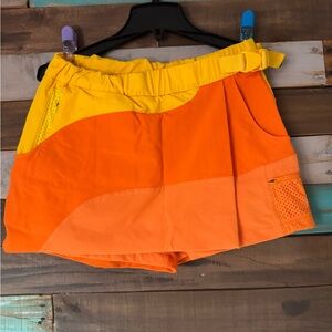 Outdoor Voices RecTrek Skort in Orange and Yellow Colorblock